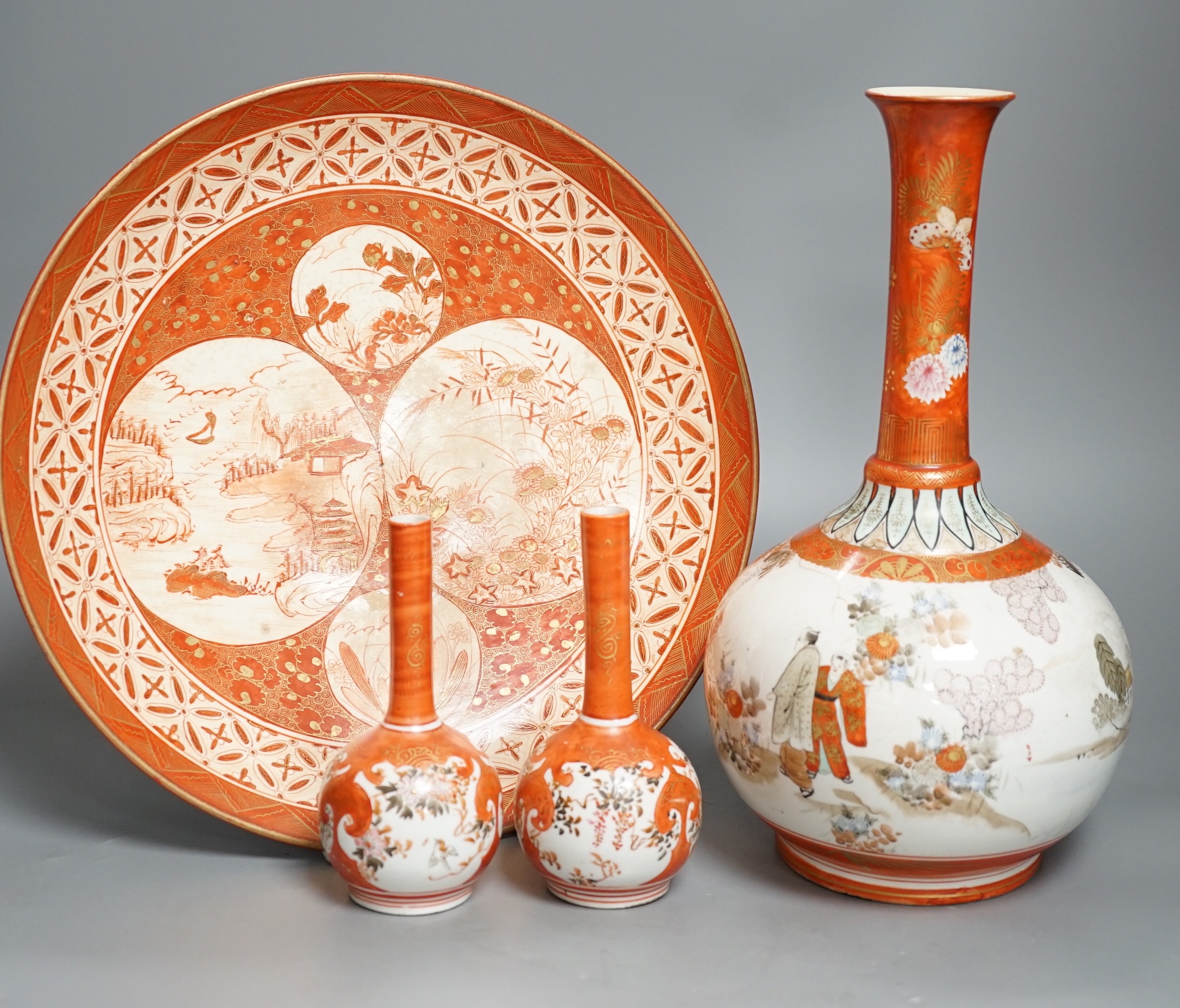 A 19th century Kutani bottle vase, a pair of smaller, similar vases and a large dish (4). Bottle vase 31cms high.